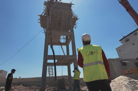 GOAL teams are installing pipelines to connect Al-Wadah displacement camp in Northwest Syria to a water pumping station. The camp is hosting over 5,000 displaced people, many of whom lost their homes in the February 2023 earthquakes. Jandires, Northern Aleppo, Syria. April 2024.